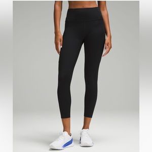 Lululemon Fast and Free Running tights. Black with purple embossing.